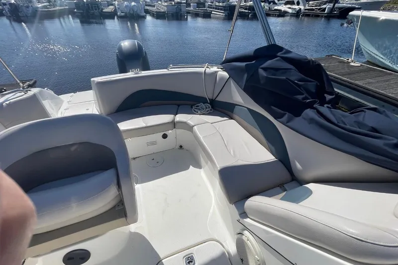 Slide: The Image of 2017 Hurricane SunDeck Sport 202 OB boat interior with seating, docked at marina. - 7