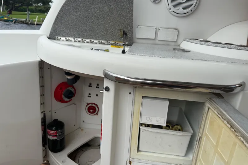 Slide: The Image of 2009 Formula 40 Performance Cruiser interior with seating and kitchenette, featuring wood-style flooring. - 10