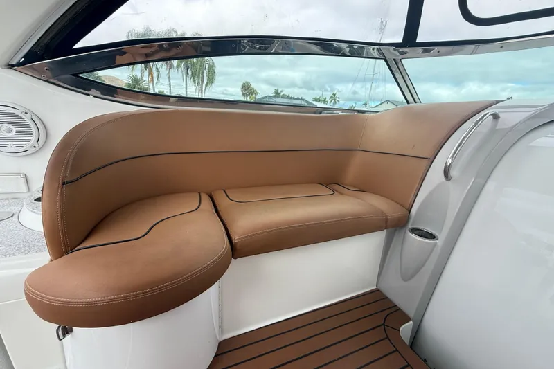 Slide: The Image of 2009 Formula 40 Performance Cruiser interior with tan seating and open gate by the water. - 12