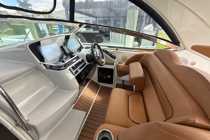 Slide: The Image of Luxurious tan seating in 2009 Formula 40 Performance Cruiser boat interior. - 13