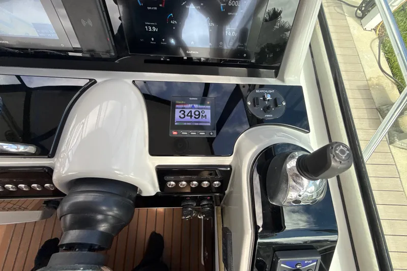 Slide: The Image of Cockpit view of 2009 Formula 40 Performance Cruiser with navigation screens and steering wheel. - 16