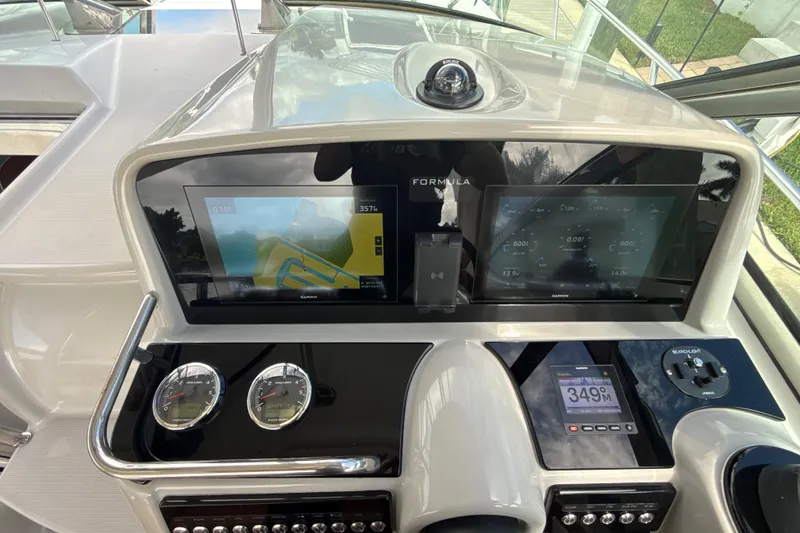 Slide: The Image of 2009 Formula 40 Performance Cruiser helm with dual displays and modern controls. - 20