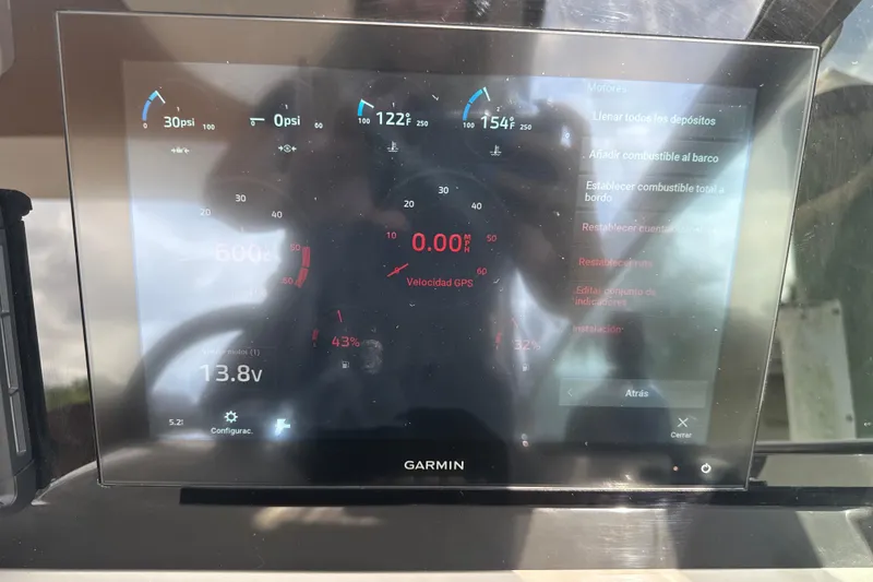 Slide: The Image of Dashboard gauges of a 2009 Formula 40 Performance Cruiser boat. - 29