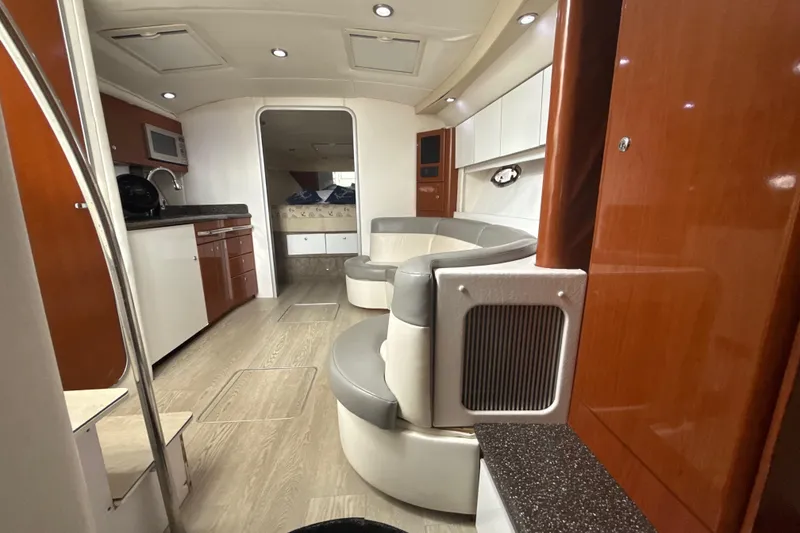 Slide: The Image of 2009 Formula 40 Performance Cruiser interior with beige leather seating and small window. - 34