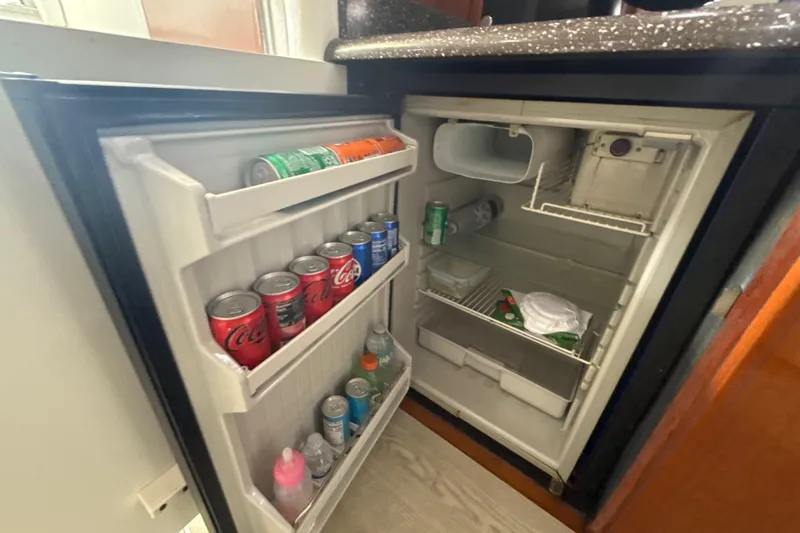 Slide: The Image of Interior of a 2009 Formula 40 Performance Cruiser with modern kitchen and seating area. - 35