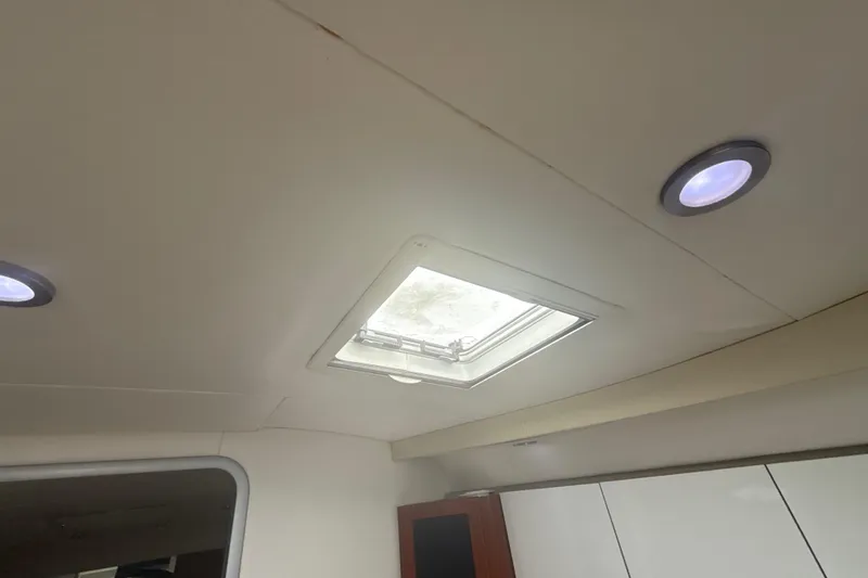 Slide: The Image of 2009 Formula 40 Performance Cruiser bathroom with sink, mirror, and frosted shower door. - 45