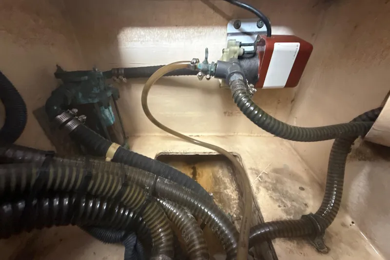 Slide: The Image of Engine compartment of a 2009 Formula 40 Performance Cruiser with visible hoses and components. - 50