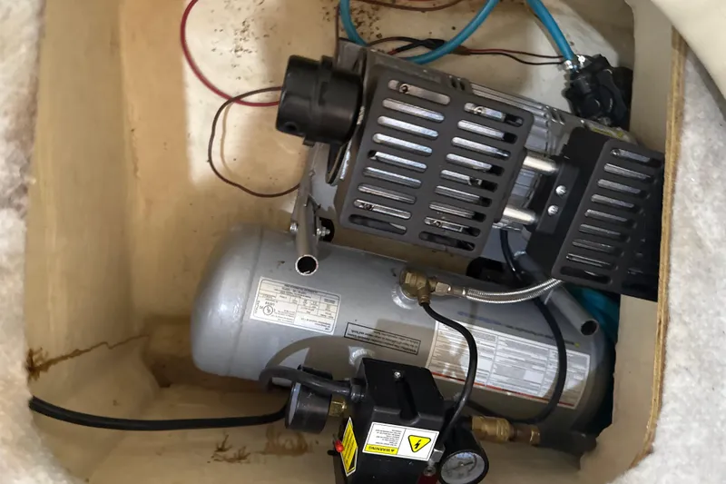 Slide: The Image of 2009 Formula 40 Performance Cruiser engine compartment with hoses and wiring. - 53