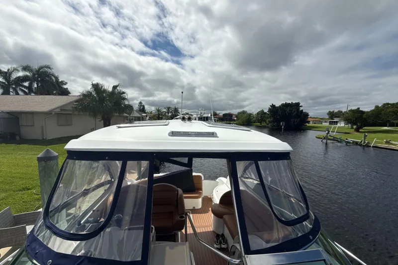 Slide: The Image of 2009 Formula 40 Performance Cruiser water system compartment with gauge and fire extinguisher. - 60