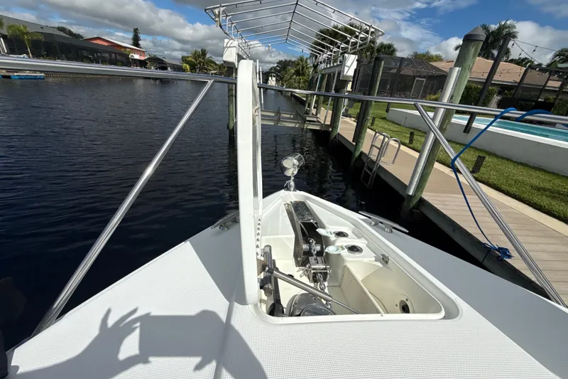 Slide: The Image of 2009 Formula 40 Performance Cruiser docked by a canal with poolside view. - 63