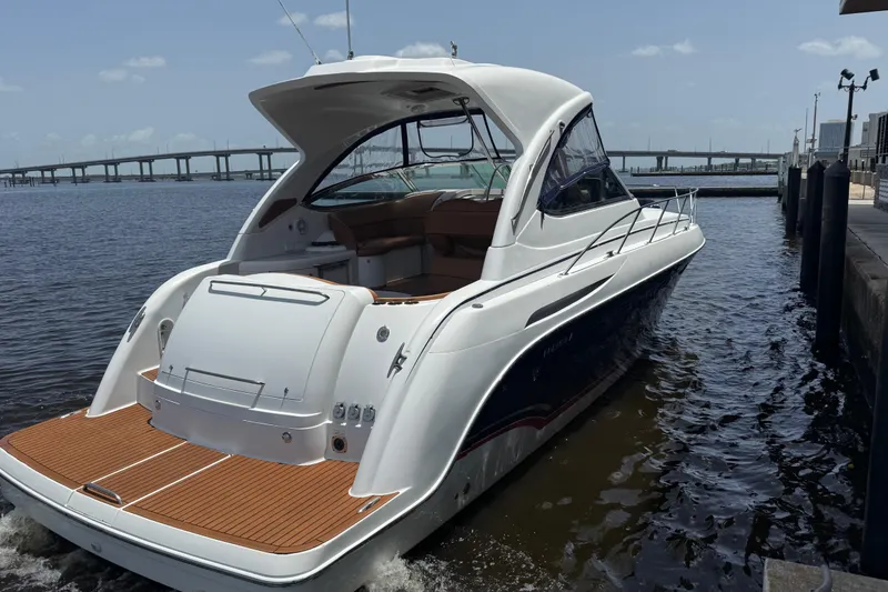 Slide: The Image of 2009 Formula 37 Performance Cruiser docked by a bridge on a sunny day. - 77