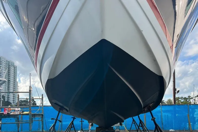 Slide: The Image of 2009 Formula 37 Performance Cruiser on stands under a clear blue sky. - 73