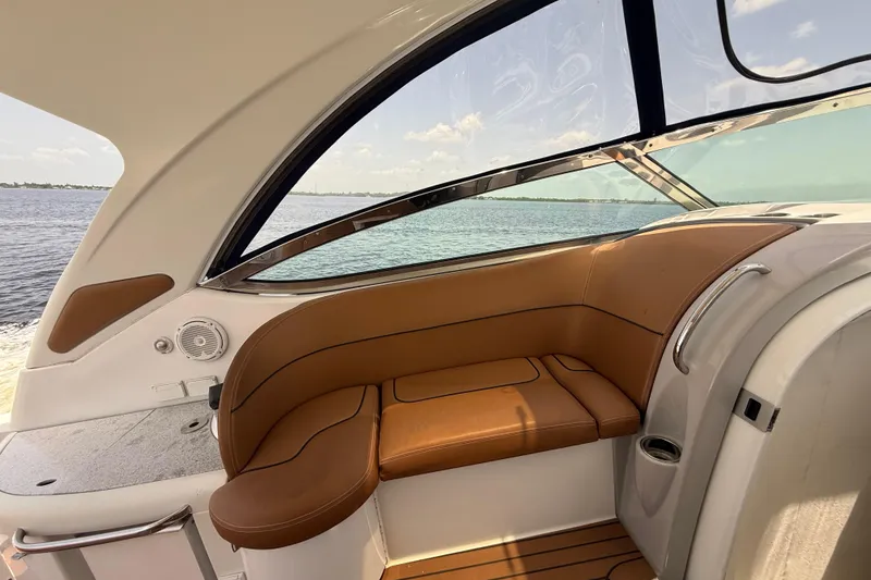 Slide: The Image of 2009 Formula 37 Performance Cruiser interior with tan seating and ocean view. - 79