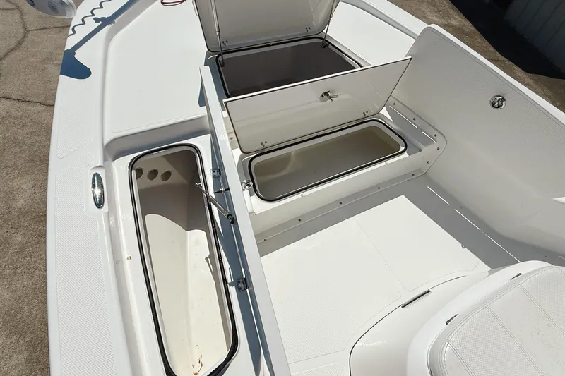 Slide: The Image of 2023 Frontier 2104 boat with Yamaha 200 engine, open storage compartment. - 10