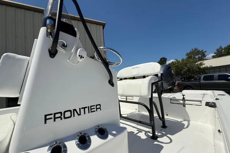 Slide: The Image of 2023 Frontier 2104 boat deck with rod holders and sleek design. - 11