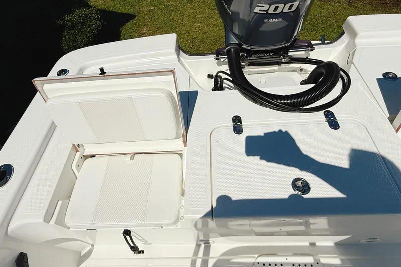 Slide: The Image of 2023 Frontier 2104 boat with Yamaha outboard motor on trailer. - 13