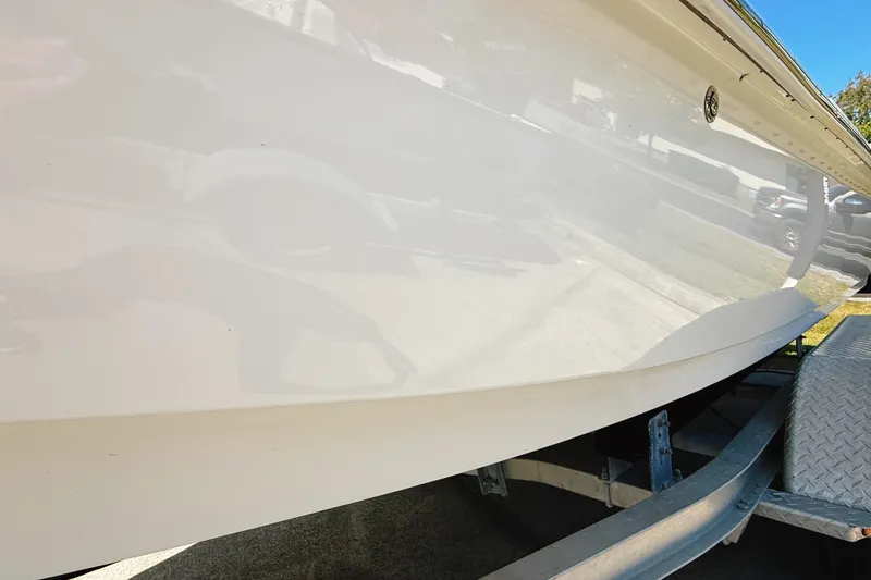 Slide: The Image of Control panel of 2023 Frontier 2104 boat with steering wheel and Yamaha throttle. - 21