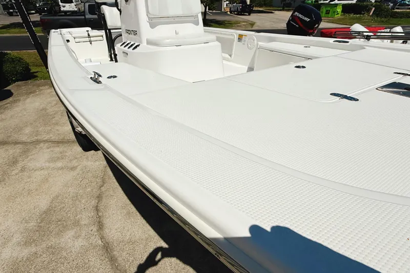 Slide: The Image of Battery compartment of a 2023 Frontier 2104, featuring an Interstate battery with connected cables. - 22