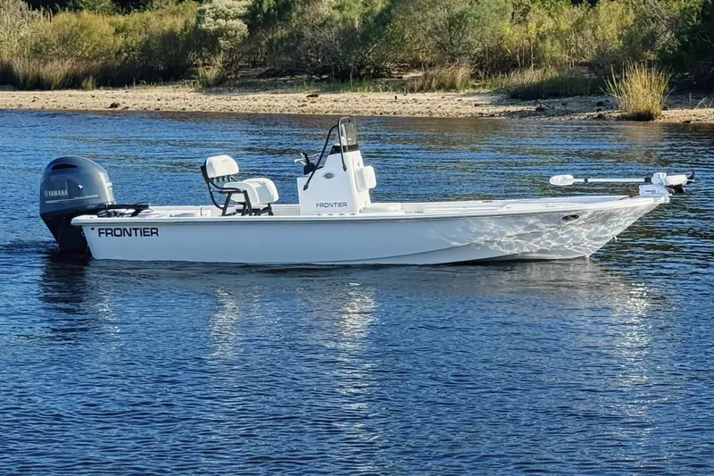 Slide: The Image of 2023 Frontier 2104 boat hull on trailer, reflecting surroundings. - 25