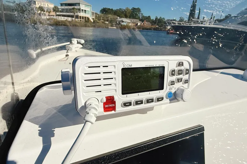 Slide: The Image of 2023 Frontier 2104 boat docked on calm water with Yamaha engine. - 30