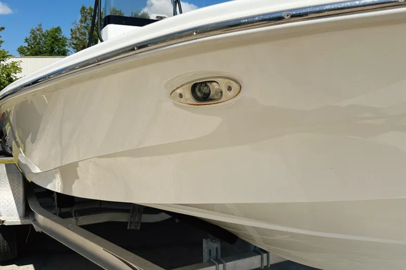 Slide: The Image of 2023 Frontier 2104 boat deck with storage compartments and Yamaha engine. - 7