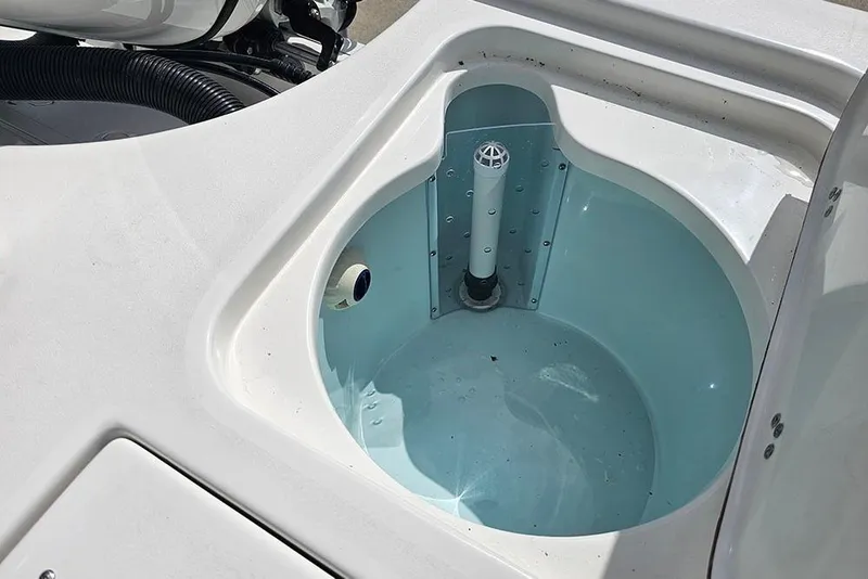 Slide: The Image of Livewell on a 2026 Sea Pro 210 Bay boat, featuring a clean, white interior design. - 11