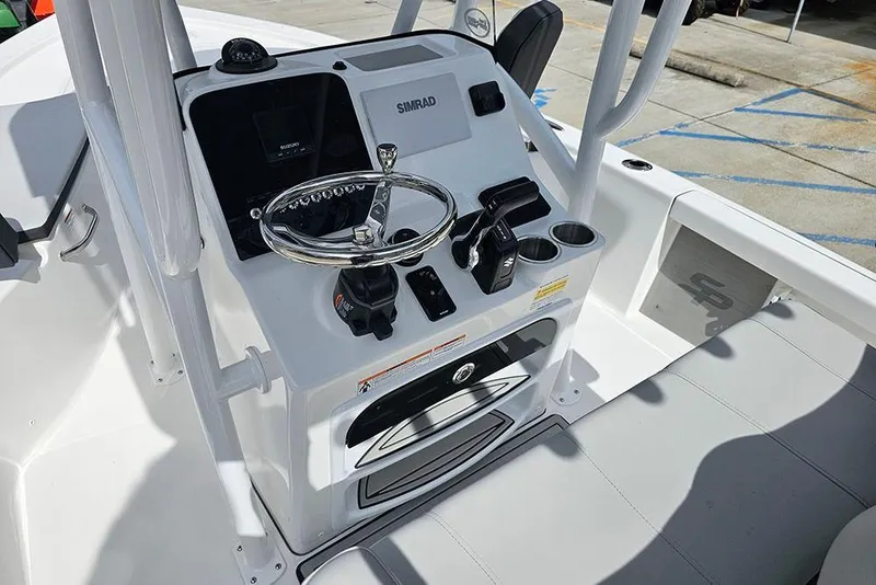 Slide: The Image of 2026 Sea Pro 210 Bay boat console with steering wheel and controls. - 16