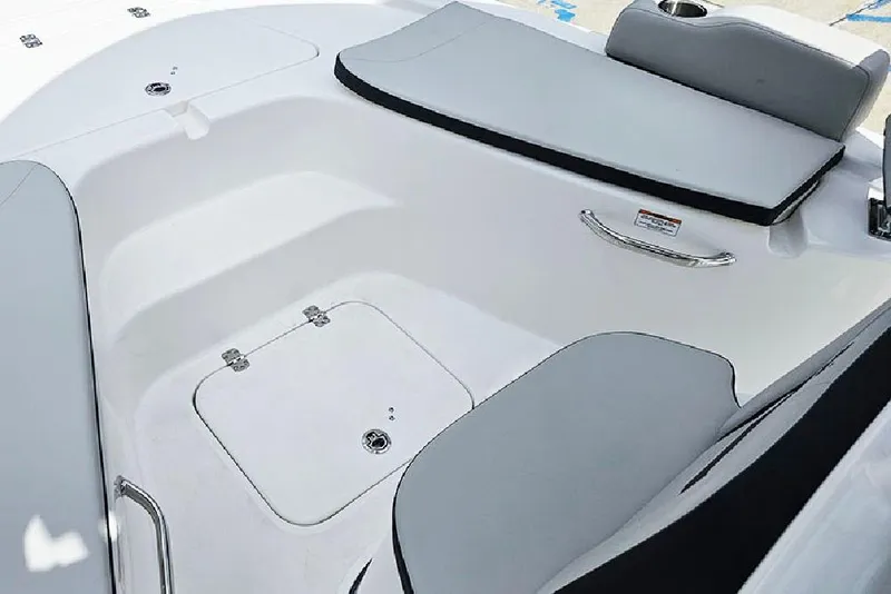 Slide: The Image of 2026 Sea Pro 210 Bay boat interior with gray seating and storage compartment. - 20