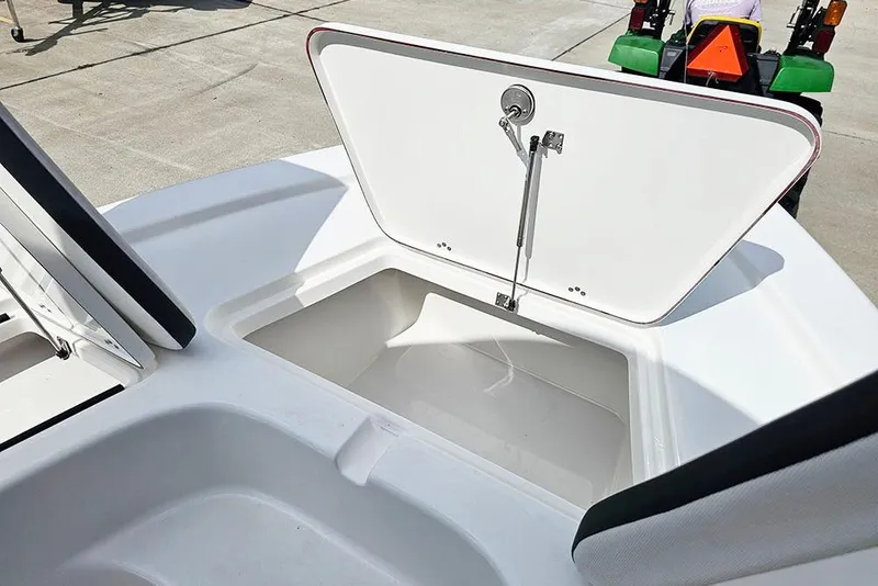 Slide: The Image of Open storage compartment on 2026 Sea Pro 210 Bay boat, showcasing spacious interior. - 23