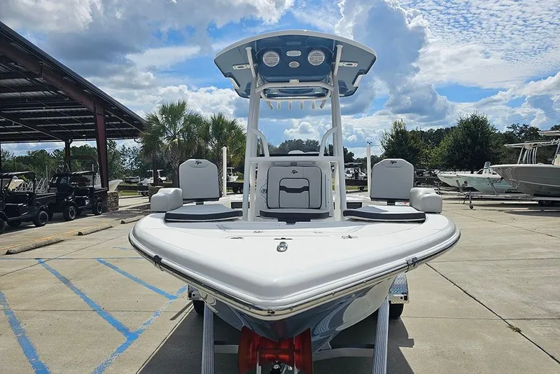 Slide: The Image of 2026 Sea Pro 210 Bay boat in marina, clear sky background. - 4