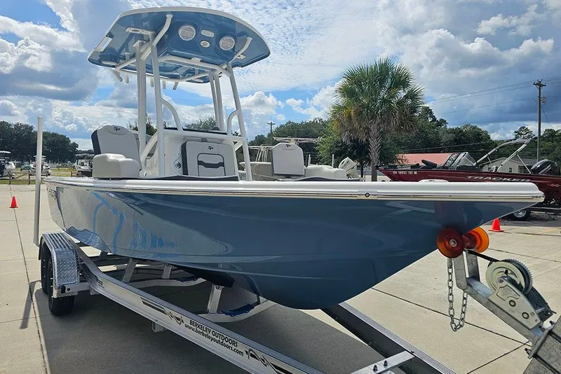 Slide: The Image of 2026 Sea Pro 210 Bay boat on trailer under cloudy sky. - 5