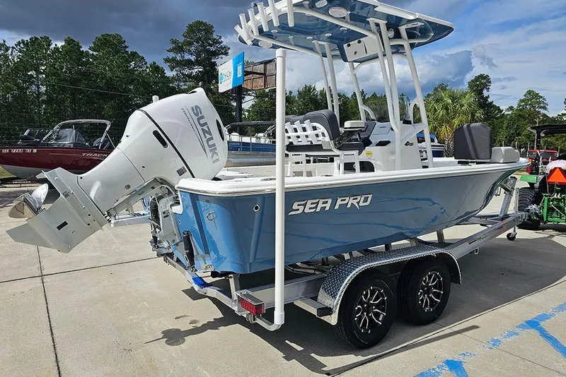 Slide: The Image of 2026 Sea Pro 210 Bay boat with Suzuki outboard motor on trailer. - 7