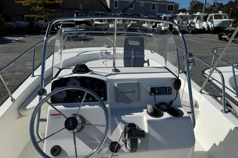 Slide: The Image of 2014 Boston Whaler 190 Montauk boat dashboard with Garmin navigation system. - 6