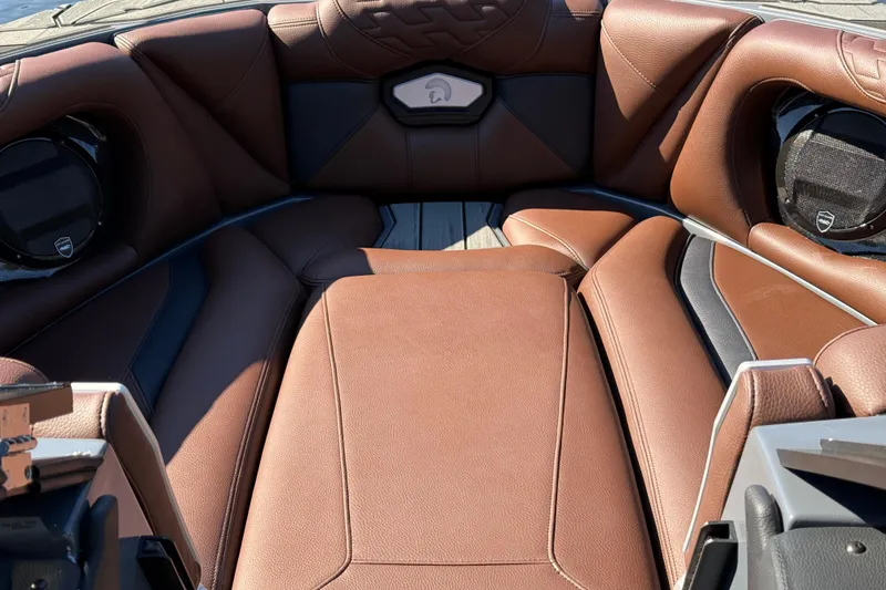Slide: The Image of Luxurious brown leather interior of 2026 Centurion Ri230 boat, featuring premium seating. - 15