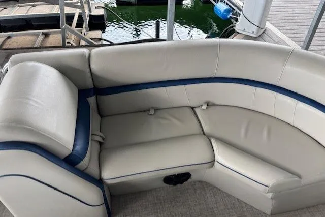 Slide: The Image of 2017 South Bay 222 RS boat interior with white and blue cushioned seating. - 19