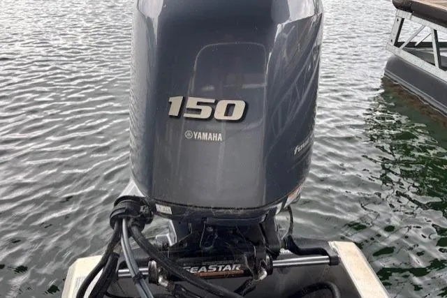 Slide: The Image of Yamaha 150 outboard motor on 2017 South Bay 222 RS boat, floating on water. - 23