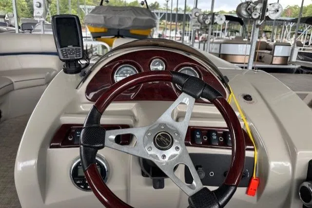 Slide: The Image of Steering console of 2017 South Bay 222 RS pontoon boat with gauges and GPS device. - 26