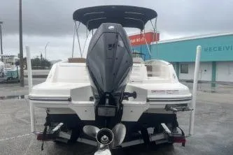 Slide: The Image of 2022 Bayliner VR6 Bowrider OB, rear view, parked outdoors on a cloudy day. - 5