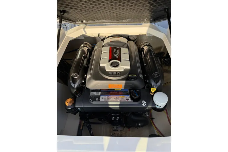 Slide: The Image of 2022 Chaparral 21 SSi engine compartment showcasing a powerful Mercury 4.5L engine. - 14