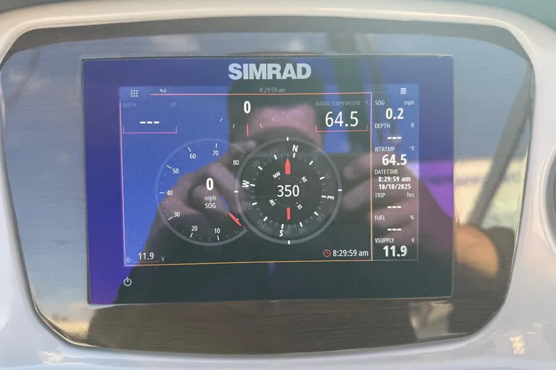 Slide: The Image of Simrad display on 2022 Chaparral 21 SSi showing navigation and water temperature. - 18