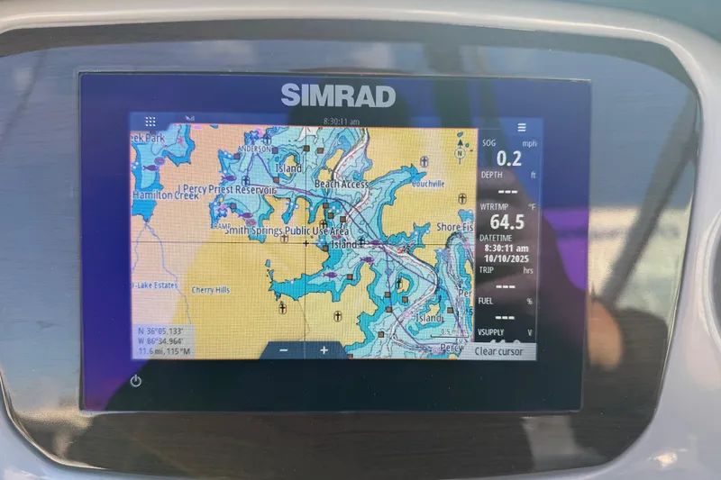 Slide: The Image of Simrad navigation display on 2022 Chaparral 21 SSi, showing map and trip data. - 19