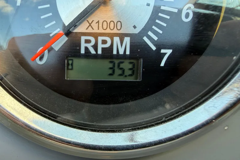 Slide: The Image of Close-up of 2022 Chaparral 21 SSi RPM gauge displaying 35.3 hours. - 20