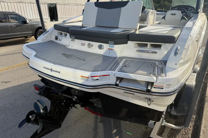 Slide: The Image of 2022 Chaparral 21 SSi boat rear view with swim platform and outboard motor. - 23