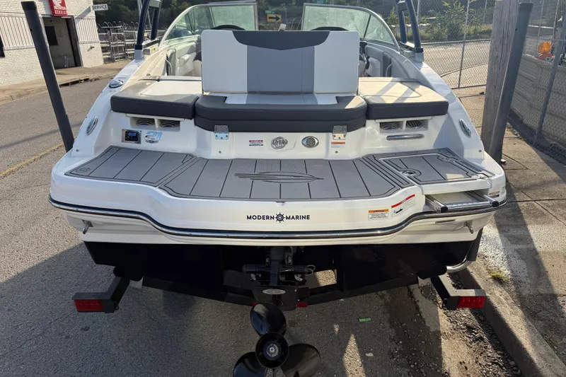 Slide: The Image of 2022 Chaparral 21 SSi boat rear view, featuring modern design and spacious seating. - 24