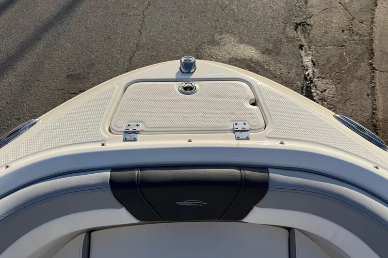 Slide: The Image of 2022 Chaparral 21 SSi boat bow with storage compartment and seating. - 5