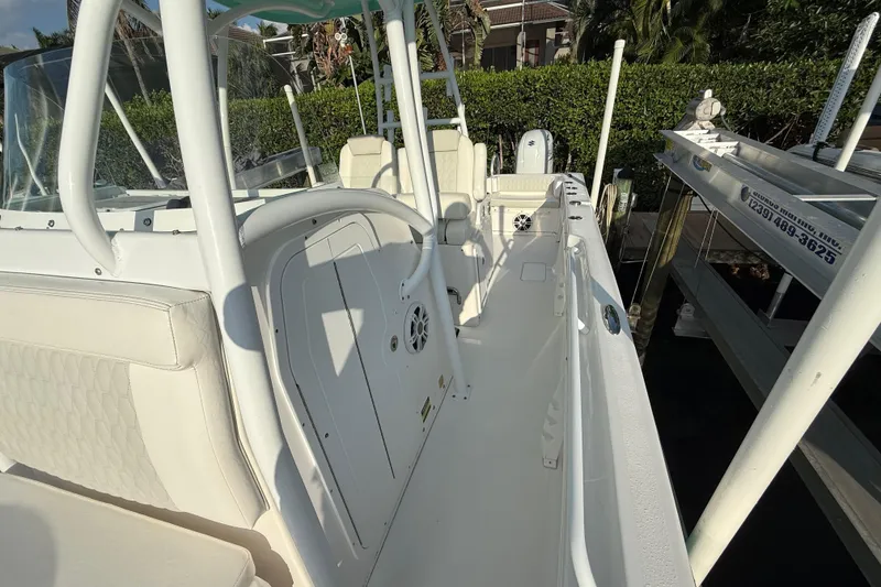 Slide: The Image of 2019 Twin Vee 26 Center Console boat with white interior and seating. - 11