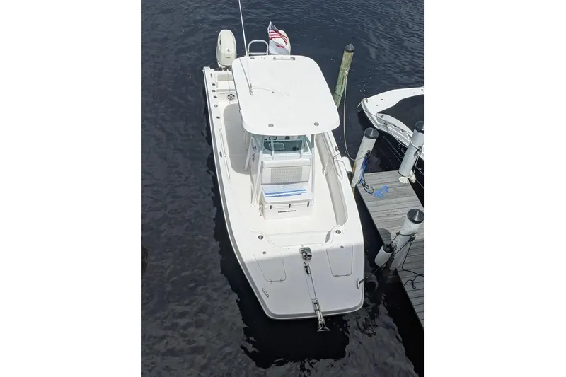 Slide: The Image of 2019 Twin Vee 26 Center Console boat docked, aerial view. - 2