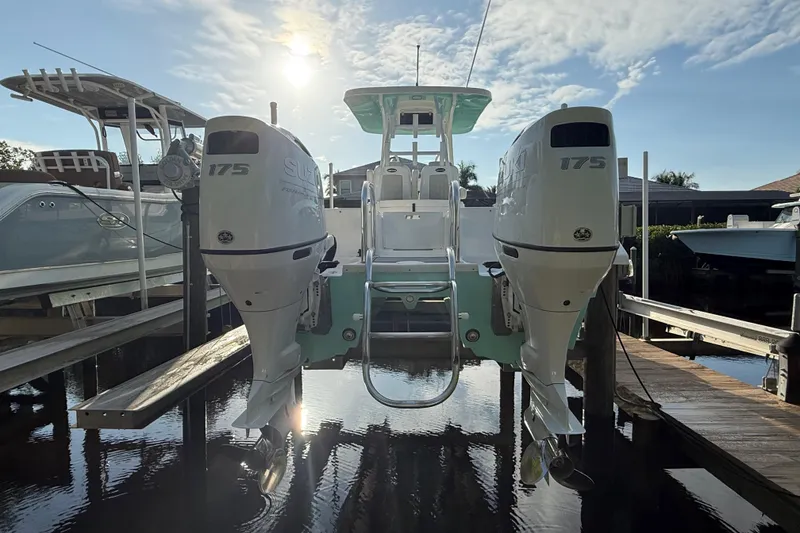 Slide: The Image of 2019 Twin Vee 26 Center Console boat with dual Suzuki 175 engines docked. - 5
