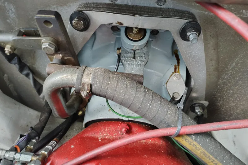 Slide: The Image of Engine compartment of a 1981 Lazy Days 50 boat, showing mechanical components and hoses. - 16