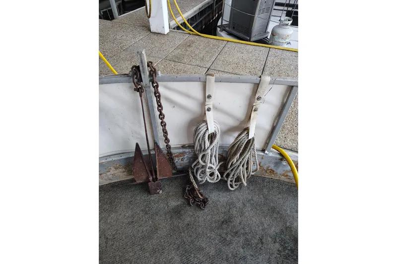 Slide: The Image of Anchor and ropes on a 1981 Lazy Days 50 boat deck. - 21